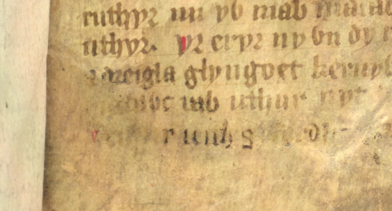 Jesus College MS 20, folio 1r, met ‘Madawc uab uthur’ (‘Madoc zoon van Uthyr’) vaag zichtbaar op de voorlaatste regel